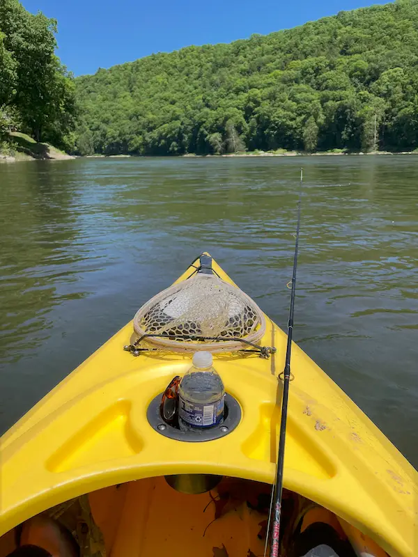 A yellow kayak on calm water representing the journey of personal growth, self-discovery, and creating a meaningful life